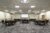 Meeting room setup with rounds and projection screen