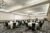 Meeting room setup with rounds and projection screen