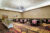 Meeting room set up with rounds and buffet table